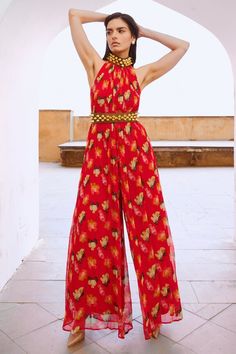 Chilly red jumpsuit with poppy planet print and bell bead embellishment on neckline. Paired with embroidered belt. - Aza Fashions Jumpsuit With Belt, Halter Neck Jumpsuit, Bead Embellishment, Embroidered Belt, Belt Jumpsuit, Red Chiffon, Belt For Women, Print Jumpsuit, Jumpsuit Pattern