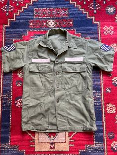 USAF short sleeve OG 107 shirt. Excellent used condition. Name, service tape, and rank all tight. See measurements to ensure a proper fit: P2P: 20 Shoulder: 17.5 Length: 26.5 Mens Oxfords, May 20, Short Sleeve Shirt, Button Downs, Sleeve Shirt, Casual Button Down Shirt, Denim Jacket, Men Casual, Tee Shirts