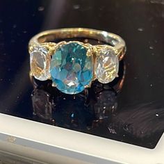 Center Stone Measures 10mm X 8mm Side Stone Es Measuring 6.5mm X 4.5mm Ring Size Shy 6.25 Us 3.5 Grams Solid 10k Yellow Gold Ring Color, Topaz Ring, White Topaz, Womens Jewelry Rings, Blue Gold, Yellow White, Topaz, Ring Size, Blue And White