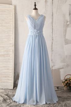 a light blue bridesmaid dress on a mannequin