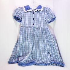 Very cute vintage girl's dress with a lace collar and very detailed buttons. No rips or stains. Totally retro looking! Spring School Dresses With Buttons, Vintage Blue Dress With Doll Collar, Vintage Dresses For School In Spring, Cotton School Dresses With Buttons, Vintage Cotton Dress For Dress-up, Vintage Cotton Dress For Dress-up Occasions, Vintage Doll Collar Dress For Dress-up, Vintage Doll Collar Dress-up Dresses, Vintage Dress With Doll Collar For Dress-up