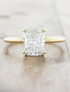 an engagement ring with a cushion cut diamond