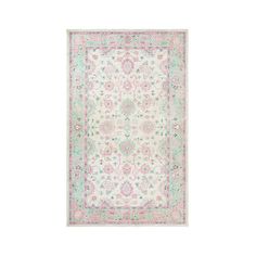 a white rug with pink and green accents