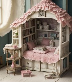 a doll house with a bed, desk and bookshelf