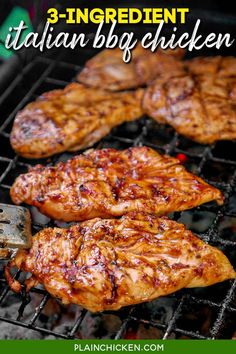 some chicken is cooking on the grill with a spatula