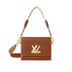 Twist PM Epi Leather - Women - Handbags | LOUIS VUITTON ® Luxury Brown Flap Bag, Luxury Cognac Flap Bag For Evening, Luxury Baguette-shaped Shopping Bags, Luxury Baguette Shopping Bags, Luxury Gold Baguette Shoulder Bag, Luxury Cognac Rectangular Flap Bag, Luxury Baguette Shoulder Bag With Dust Bag, Luxury Tan Flap Bag With Removable Pouch, Handbags Louis Vuitton