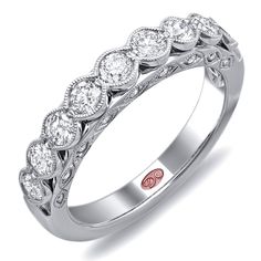 a white gold wedding band with five diamonds