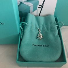 Authentic Sterling Silver And Tiffany Blue Enamel Tiffany Christmas Tree Charm. This Rare, Retired Charm Is In Euc With Very Light Wear Showing. Includes Box And Pouch. No Trades Tiffany Prices Keep Going Up So Buying Now Is A Smart Investment. Values Keep Increasing Tiffany Christmas, Jewelry Tiffany, Christmas Tree Charm, Tiffany Co Jewelry, Tiffany Blue, Keep Going, Tiffany & Co., Blue And Silver, Investment