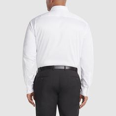 This Van Heusen dress shirt is made from stretch fabric specially treated with advanced wrinkle-free properties for less ironing, even right out of the dryer. This essential style is finished with a Flex collar that gives your neck a break by expanding up to a 1/2 inch so every move you make is a comfortable one.Features: Wrinkle Resistant, Stretch Fabric, Stretch Collar, Wrinkle FreeClosure Type: ButtonFit: Regular FitNeckline: Collar NeckPockets: 1 Chest Slip PocketSleeve Length: Long SleeveS… Elegant Business Tops Wrinkle-resistant, Elegant Business Top With Wrinkle-resistant Fabric, Elegant Wrinkle-resistant Business Top, Elegant Wrinkle-resistant Work Tops, Elegant Wrinkle-resistant Tops For Work, Fitted Wrinkle-resistant Tops For Office, Fitted Wrinkle-resistant Business Tops, White Slim Fit Dress Shirt For Daywear, Elegant Wrinkle-resistant Dress Shirt