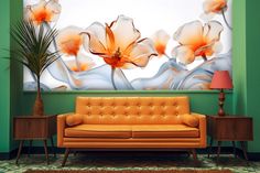 an orange couch sitting in front of a large painting