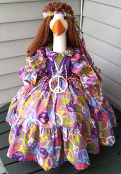 a dress made to look like a doll with a peace sign on the front and neck