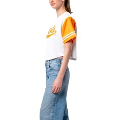 The Women's Established & Co. White Tennessee Volunteers Baseball Jersey Cropped T-Shirt is the perfect way to show your support for the Tennessee Volunteers. This stylish and comfortable shirt features embroidered fabric applique and graphics, a rounded bottom hem, and a full-button front. Made from durable polyester, this cropped t-shirt is perfect for game day or any day you want to show your Tennessee Volunteers pride. Full-button front Material: 100% Polyester Rounded bottom hem Importe Varsity Tops With Text Print, Collegiate Style Tops With Text Print For Spring, Collegiate Style Text Print Tops For Spring, White Varsity Top For Spring, White Sporty Cropped T-shirt With Text, Sporty White Cropped T-shirt With Text Print, Athleisure Short Sleeve Tops For College, Collegiate Short Sleeve Tops For Spring, Collegiate Short Sleeve Relaxed Fit Tops