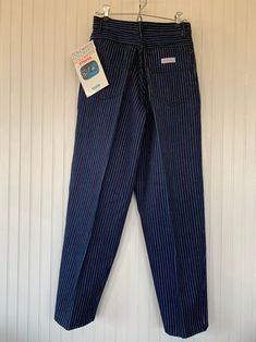 "Rare NWT Vintage Early 80s High Waisted Dark Denim Pinstriped Blue Jeans, by Gitano. Rainbow pastel pinstripes. Short length, high waisted & baggy fit. New condition and unworn with original tags. Super high rise waist. Front & back pleated down center of leg. Dark denim with pinstripes down legs. Amazing Mint condition with original store tags! Brand - Gitano Condition - Original. Deadstock from the 80s, New with original tags 100% Cotton Made in Hong Kong Machine Washable Vintage Size Vintage Striped Straight Leg Bottoms, Retro Striped Denim Bottoms, Retro Striped Cotton Jeans, Vintage Cotton Bottoms With Vertical Stripes, Vintage Striped Bottoms For Workwear, Vintage Striped Fitted Pants, Retro High Waist Striped Pants, Retro Cotton Pants With Vertical Stripes, Pinstripe Jeans