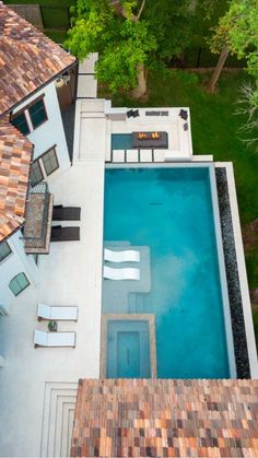 an aerial view of a house with a swimming pool