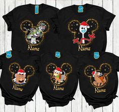 three shirts with cartoon characters on them, one is black and the other has gold glitter