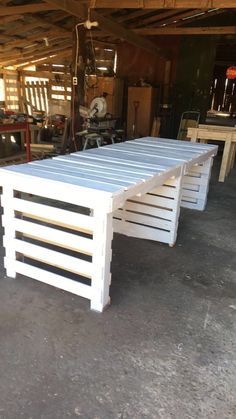 a table made out of pallets in a garage