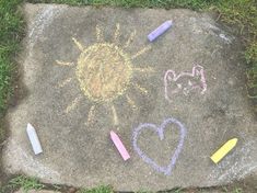 chalk drawings on the ground with crayons and pencils