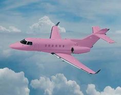 a pink airplane flying through the sky with clouds in the backgrounnds