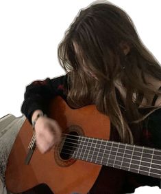 a woman with long hair playing an acoustic guitar in front of a white background,