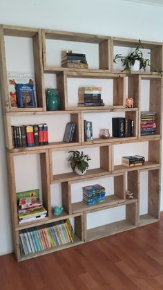 the bookshelf is made out of wooden pallets