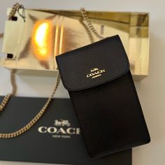 Coach Black Crossbody Bag With Gold Strap. Brand New! Snap Closure. Style F89282. Strap With 33” Drop Wear As A Crossbody Or A Shoulder Bag. 4 1/4” Long X 7” High X 1 1/4 Width. Comes With Coach Gift Box. All Sales Are Final. Black Rectangular Phone Bag With Chain Strap, Classic Bags With Chain Strap, Classic Bag With Chain Strap, Classic Bag With Chain Strap As Gift, Chic Black Phone Bag Gift, Chic Black Phone Bag For Gift, Chic Black Phone Bag As Gift, Classic Chain Strap Bag As Gift, Classic Chain Strap Bag