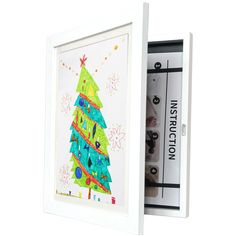 a christmas tree is in a white frame