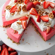 there is a cake with strawberries on it