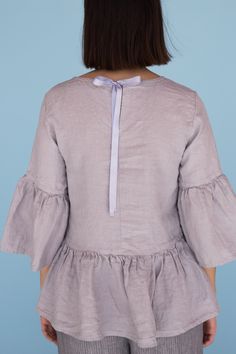 "MsWrinkle's clothing - from human to human. 100% handmade. *Description* - Linen blouse with ruffles and cute bow on the back; - High quality European linen; - Washed and softened (doesn't shrink anymore); - Medium weight linen (150 g/m2); - Our linen is OEKO-TEX certified that meets human ecological safety requirements; - Model is wearing size S in elephant grey (other sizes and colors please choose on the right); - Not transparent; - Not ironed and we suggest to use tumble dryer to keep soft Summer Tops With Gathered Flutter Sleeves, Summer Flutter Sleeve Top With Gathered Sleeves, Summer Linen Peasant Top With Relaxed Fit, Spring Linen Top For Brunch, Fitted Blouse With Ruffle Hem And Flutter Sleeves, Fitted Tops With Ruffle Sleeve For Daywear, Summer Linen Blouse With Gathered Sleeves, Spring Linen Ruffle Tops, Linen Peasant Top For Summer