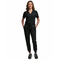 Be prepared for whatever your workday has to offer in this sporty, yet professional womens scrub set. Stay on-trend in this modern uniform that includes a tuck-in scrub top and slim-fit jogger scrub pant. Built to last, this wrinkle resistant, non-see-through fabric is machine washable and will hold up after multiple washings. This versatile womens scrub top can be worn tucked in or out for a variety of trendy looks. The slim-fit jogger scrub pant features an elastic jogger hem and a full elasti Modern Uniform, Scrubs For Women, Womens Scrub Tops, Women Jogger Pants, Black Scrubs, Slim Fit Joggers, Nurse Uniform, Womens Scrubs, Scrub Sets