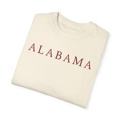 Wrap yourself in Southern charm with our Alabama-inspired tee! Crafted on ultra-comfortable Comfort Colors Unisex T Shirt, it's a cozy nod to the Heart of Dixie. Whether you're strolling through Birmingham or soaking up the Gulf Coast, this shirt is your perfect blend of comfort and Alabama pride. Elevate your wardrobe with a touch of Southern hospitality - wear your love for Alabama in style!" Printing: DTG printing method is used for these sweatshirts. A process of printing on textiles and garments using specialized or modified ink jet technology. The three key requirements for a DTG printer are a way to hold the garment in a fixed position, an inkjet print head, and specialty inks that are applied to the textile directly by the print head, and are absorbed by tr garment's fibers. Produc Relaxed Fit Short Sleeve Fan Apparel Sweatshirt, Short-sleeve Cotton Sweatshirt For College, Red Relaxed Fit T-shirt For College, Relaxed Fit Fan Apparel Crew Neck Shirt, Red Crew Neck Shirt For College, Alabama Gifts, Alabama Shirts, University Of Alabama, Red Shirt