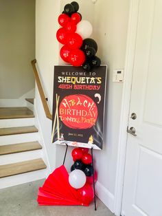 a birthday party with balloons and decorations on the front door steps, including a sign that says sheuteta's ash birthday under party