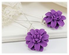 Handmade Purple Dahlia dangle earrings or drop earrings. Available in several purple shades. Each petal is formed by hand. Choose from assorted kidney or leverback earwires or titanium (hypoallergenic) short hooks. -Original hand sculpted polymer clay flowers -Durable, water-resistant -No molds, no paint, no glue -Assorted earwires to choose from -Titanium (hypoallergenic) option available -Flower size : 1.5cm -Lightweight earrings View matching collection and more colors at: https://www.etsy.co Purple Flower Shaped Earrings, Purple Flower Earrings With Ear Wire For Gift, Purple Flower Earrings With Ear Wire As Gift, Purple Flower Charm Earrings, Purple Hypoallergenic Flower Drop Earrings, Purple Hypoallergenic Drop Flower Earrings, Hypoallergenic Purple Flower Drop Earrings, Lavender Drop Flower Earrings, Lavender Dangle Flower Earrings