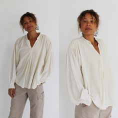 "the perfect soft off-white blouse, with a button front and ruched baggy sleeves.  tags has faded.  Measures:  Chest: 48\" Waist: 54\" Sleeve: 23\" Length: 27\" Condition:  FOLLOW US ON INSTAGRAM FOR DEALS AND SNEAK PEEKS! @Wildthingvintage instagram.com/wildthingvintage Twitter: @Wildthingpeck Message me any time for further details or questions. Please note there is a 10% restocking fee on orders cancelled prior to shipment. Returns are upon a case by case basis, and only if the item is not as described. I will happily expedite or overnight shipping at cost upon request. Standard shipping to the US and Canada is 2 weeks. Interested in more than one treasure? Message me for a discount on multiple orders! Live in Toronto? Arrange a pickup and save mailing costs! Message me any time for fur Billowy Shirt, Baggy Sleeves, Balloon Sleeve Blouse, Blouse Shirt, White Blouse, Shirt Top, Womens Clothing Tops, Sleeve Blouse, Top Shirt