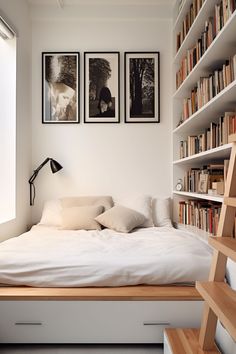 a bed with white sheets and pillows in a bedroom next to a book shelf filled with books