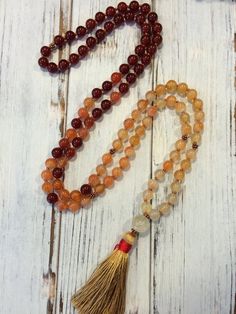 Absolutely gorgeous Carnelian and Citrine 108 Mala beads for vitality, energy, success and happiness.Details:Made with 108 A Grade red and orange Carnelian with copper spacer beads to use as markers during meditation to help bring your focus back to your breath or intention. They are hand knotted with earthy brown silk cord between each bead which creates a nice feel in your hands during meditation, or drapes beautifully when worn as a necklace. It also makes it very durable. I have used a large Handmade Red Mala For Healing, Spiritual Carnelian Beads For Jewelry Making, Orange Spiritual Beaded Necklace With Natural Stones, Spiritual Orange Beaded Necklace With Natural Stones, Orange Beaded Necklaces With Natural Stones In Spiritual Style, Spiritual Red Carnelian Beads, Red Carnelian Spiritual Beads, Orange Spiritual Necklace With 108 Beads, Orange Spiritual Beads 8mm