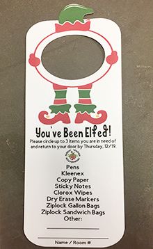 a white door hanger with an elf's legs on it and the words you've been elf