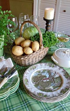 the table is set with dishes and plates