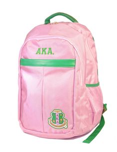 a pink backpack with green straps and the letters aka on it's side