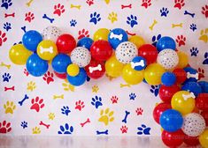 a bunch of balloons that are in the shape of a dog's paw print