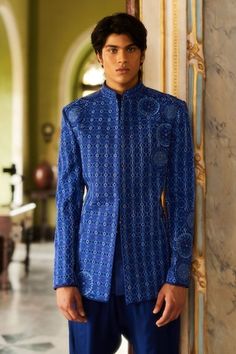 Blue bandhgala featuring thread embroidered geometric motifs highlighted by tonal crystal and bead embellishments. Comes with straight pant. - Aza Fashions Designer Blue Traditional Wear For Reception, Blue Bandhgala With Mirror Work For Wedding, Wedding Blue Bandhgala With Mirror Work, Fitted Hand Embellished Kurta For Eid, Traditional Hand Embellished Blue Set, Fitted Blue Embellished Traditional Wear, Fitted Embellished Blue Traditional Wear, Designer Fitted Kurta With Motifs, Fitted Hand Embellished Kurta For Festivals