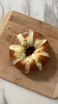 a bundt cake sitting on top of a wooden cutting board