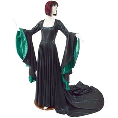 "This dramatic gown is created from our metallic Black Mystique spandex, with a darted fit and flare bodice, square neckline, and sorceress sleeves lined in Green Kaleidoscope.  It is full circle cut, with a 36\" train in back. Created for an average height of 5'6\" to 5'8\", if you are taller or shorter than that, please put your height in the notes section at checkout! Made to order, ships out within five days of purchase. Womens Sizing (See below for instructions on where measurements should Metallic Fitted Floor-length Gown, Dramatic Gown, Witch Costumes, Average Height, Olive Branch, Full Circle, Square Necklines, Large Bust, Small Bust