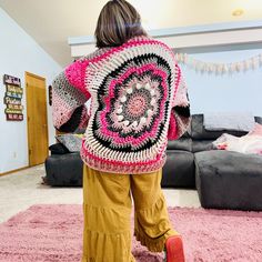 Whimsical Windmill Cardi - A Sustainable Crochet Masterpiece 🌸✨ Embrace warmth, style, and sustainability with our handcrafted Whimsical Windmill Cardi! ✨🌸 Description: Introducing the Whimsical Windmill Cardi, a true embodiment of eco-conscious fashion. Crafted entirely from leftover yarn scraps, this unique piece ensures that no material goes to waste. I was sure to try and pick a pink, black, gray and white color scheme so the colors would blend harmoniously to create a stunning, cohesive design. This chunky, oversized cardigan is not only a statement of style but also a commitment to sustainability. Features: *Hand-Crocheted Artistry: This cardi is meticulously crafted by hand, ensuring a unique and personal touch in every piece. *Sustainable Design: Made exclusively from leftover ya Pink Bohemian Crochet Outerwear, Handmade Bohemian Pink Cardigan, Handmade Pink Bohemian Cardigan, Handmade Artisan Winter Outerwear, Bohemian Hand Knitted Pink Cardigan, Hand Knitted Bohemian Pink Sweater, Pink Hand Knitted Bohemian Sweater, Pink Bohemian Hand-knitted Sweater, Pink Bohemian Hand Knitted Sweater