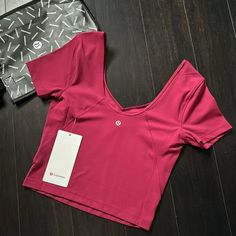 Brand New With Tags Lululemon Align Tee Color Pomegranate (Pome) Sold Out Color Size 6 Guaranteed Authentic 5 Star Rated Seller Next Day Shipping H520 Lulu Lemon Logo Pink, Purple Athleisure Tops For Pilates, Purple Short Sleeve Activewear For Workout, Moisture-wicking Purple Tops For Pilates, Purple Workout T-shirt, Purple Short Sleeve Top For Workout, Purple Short Sleeve Workout Top, Casual Purple Tops For Pilates, Lulu Lemon Tops