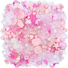 a large pile of pink and white buttons