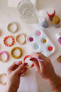 a person is making some crafts with craft supplies on the table and text overlay reads how to make diy photo frame magnets