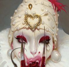 a close up of a clown's face with scissors and pearls on his head