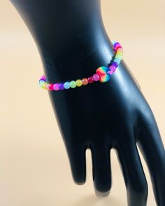 Brighten up your day and everyone around you by wearing this lively stretchy bracelet. Such a pretty multicolored beaded stretchy bracelet this one is! Created with 4mm glass beads and a beautiful polymer multicolored heart accent bead. Was made with a very strong and durable stretch cord. You will definitely get lots of compliments and it's an accessory that will match with all your outfits! Please send me a message for any inquiries and thank you for stopping by out store. Adjustable Multicolor Hypoallergenic Stretch Bracelet, Multicolor 8mm Bead Wristband Gift, Multicolor 8mm Beads Wristband For Gift, Multicolor 8mm Beaded Wristband, Hand-strung Multicolor Bracelets For Friendship, Adjustable Multicolor Hypoallergenic Bracelets, Trendy Adjustable Multicolor Stretch Bracelet, Adjustable Hypoallergenic Multicolor Bracelets, Trendy Multicolor Adjustable Stretch Bracelet