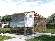 the chicken coop is built into the side of the house and has an attached porch