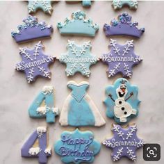 decorated cookies are arranged in the shape of snowflakes and princess tiara's